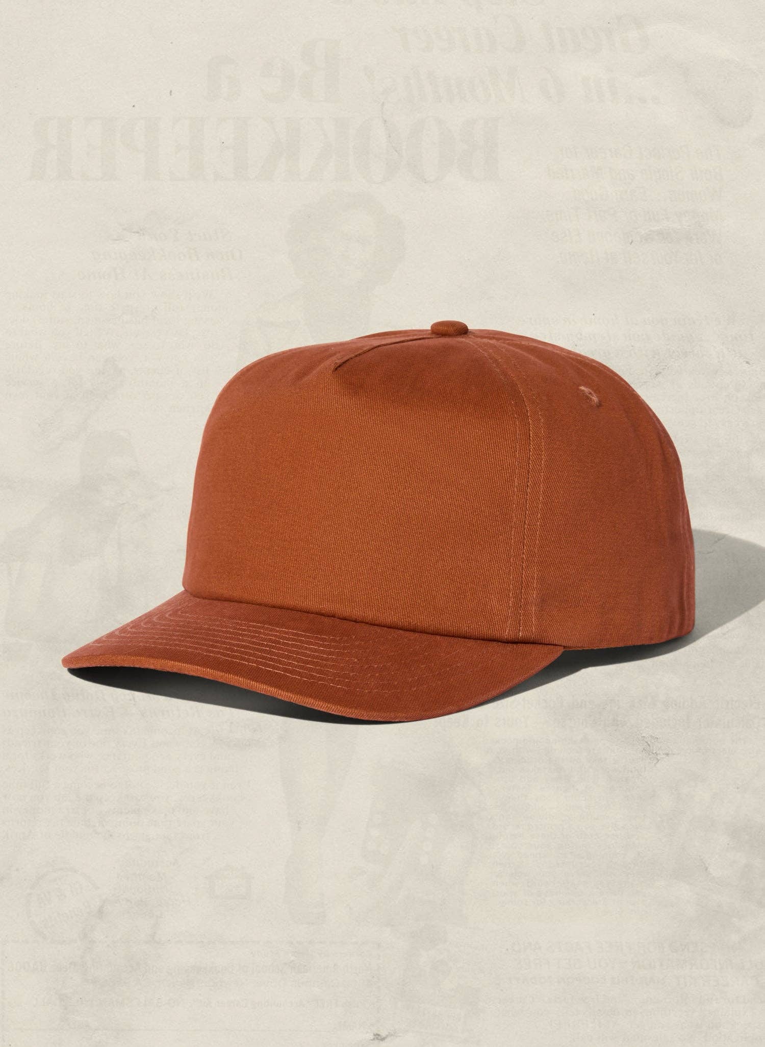 Brown cap on a beige background