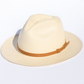 Beige straw hat with a brown band on a white background