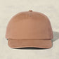Brown baseball cap on a beige background