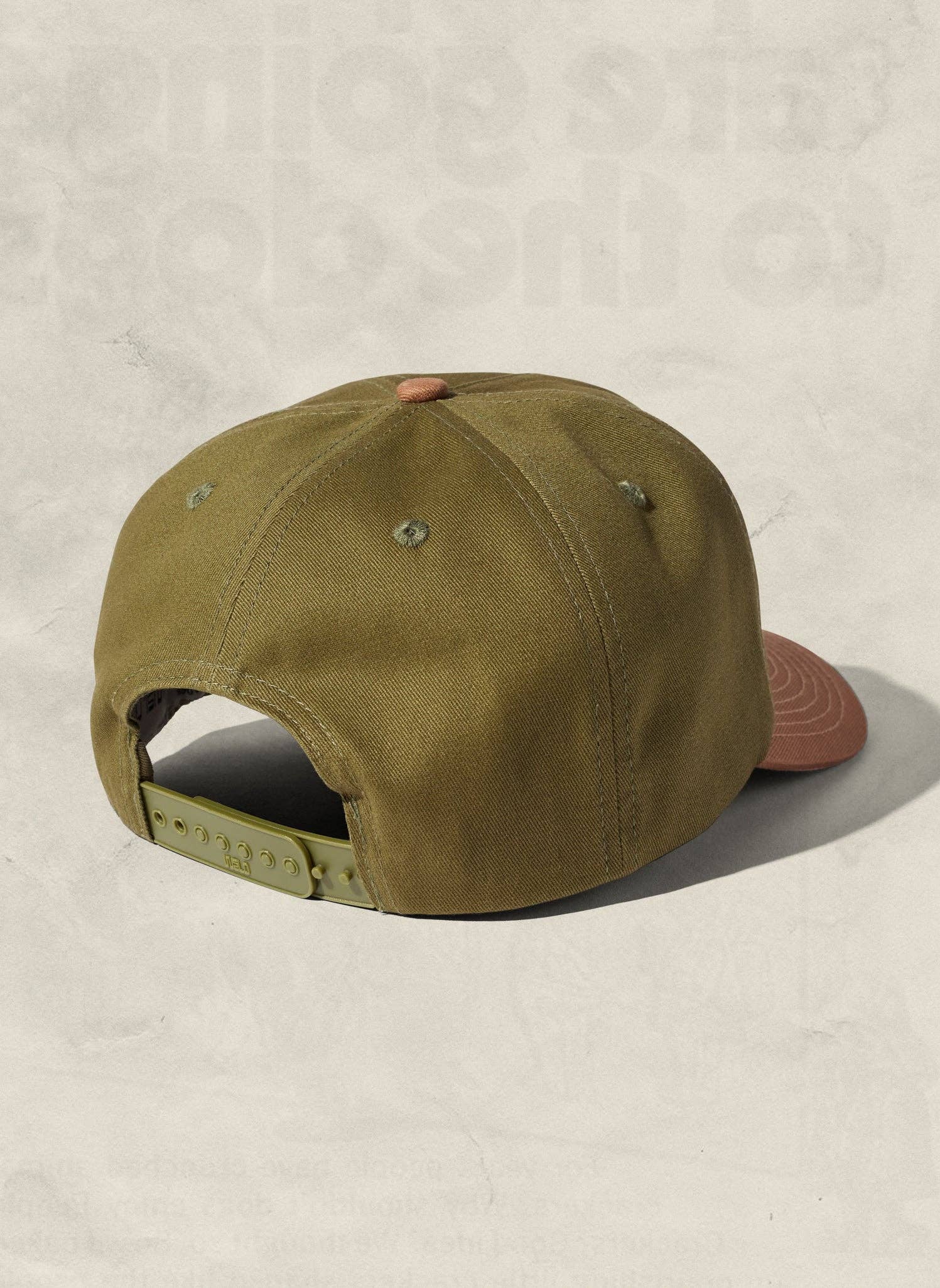 Green cap on a beige background
