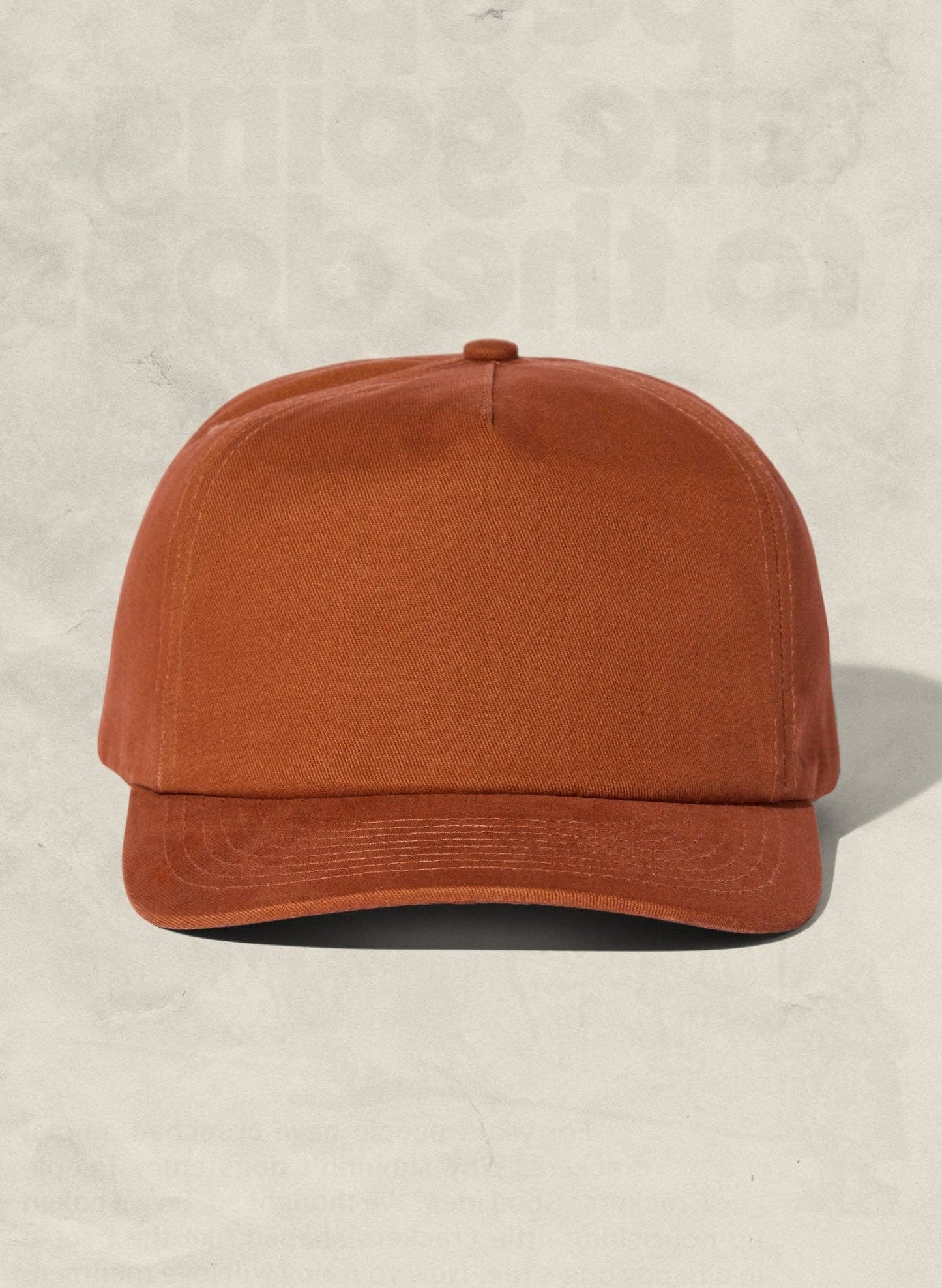 Brown cap on a beige background