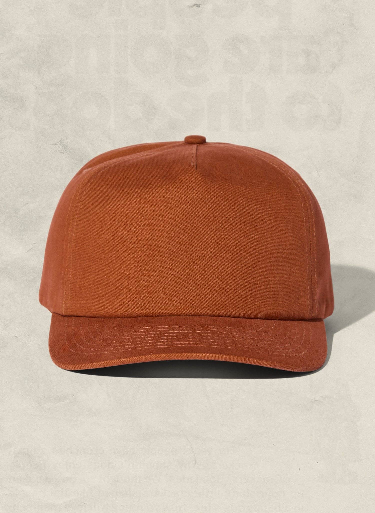 Brown cap on a beige background