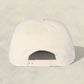 White cap on a light beige background