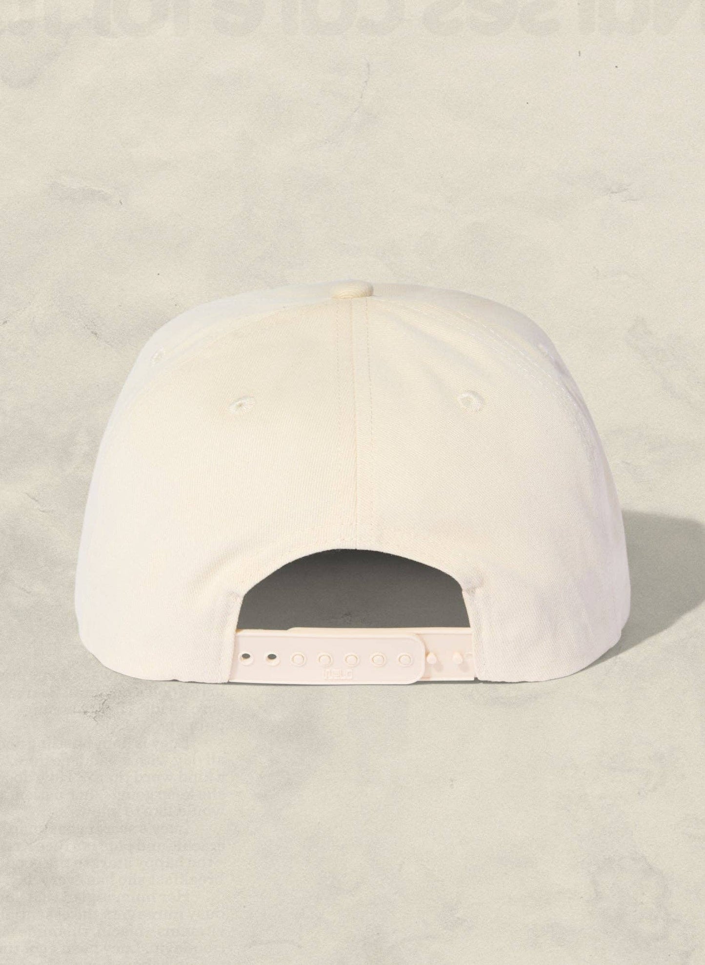 White cap on a light beige background