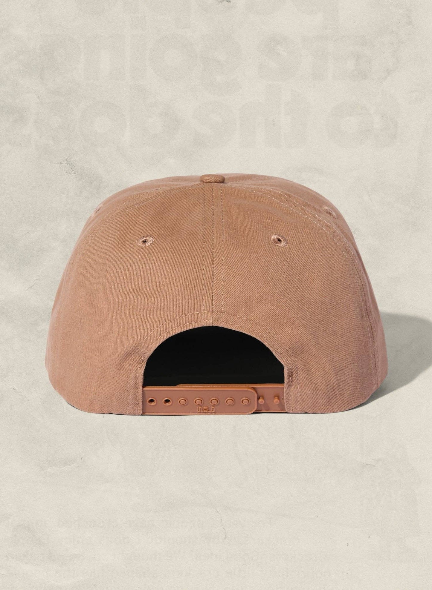 Brown cap on a beige background