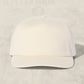 White baseball cap on a light beige background