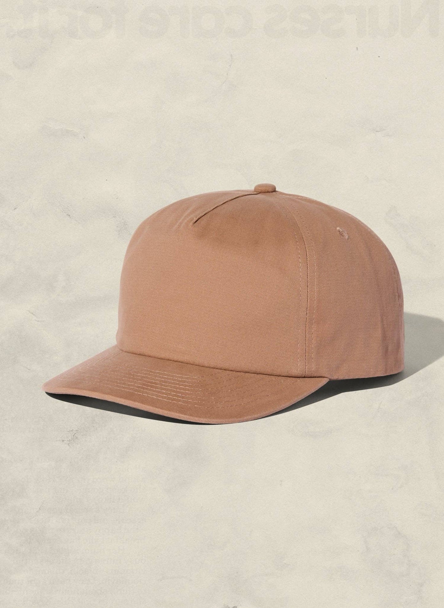 Brown cap on a beige background