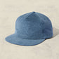 Blue checkered cap on a beige background