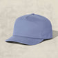 Blue baseball cap on a beige background