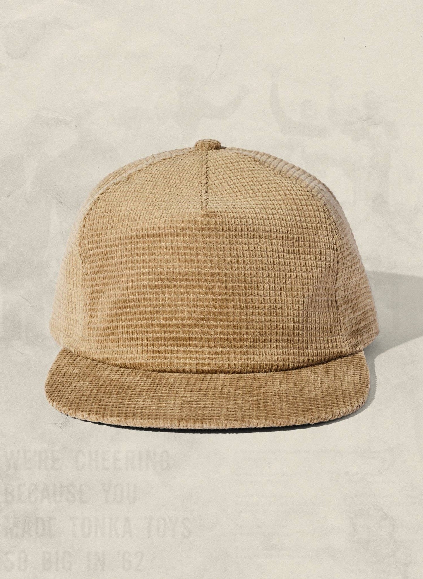 Beige waffle-textured cap on a light beige background