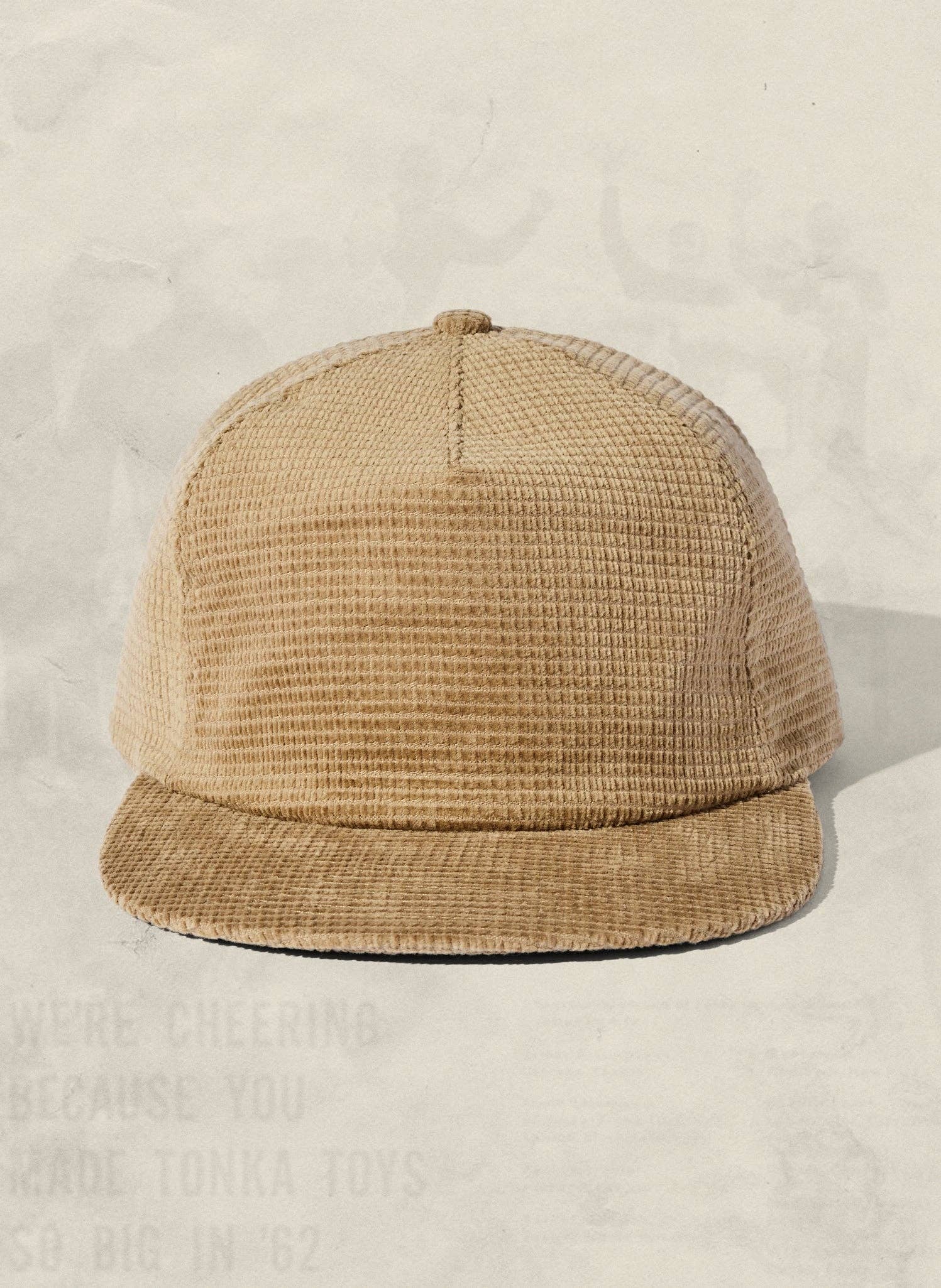 Beige waffle-textured cap on a light beige background